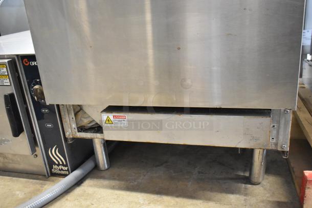 Cookline stainless steel 4 burner electric hot plate range with oven. Features control panel, visible safety labels.