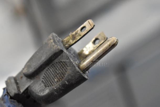 Close-up of worn power plug for a Hobart 1612 meat slicer, 115 volts, 1 phase, indicating used condition.