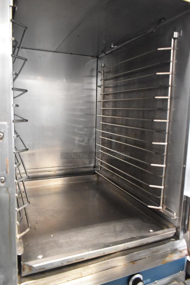 Alto Shaam Halo Heat stainless steel commercial Cook N Hold oven with racks and commercial casters, in good condition.