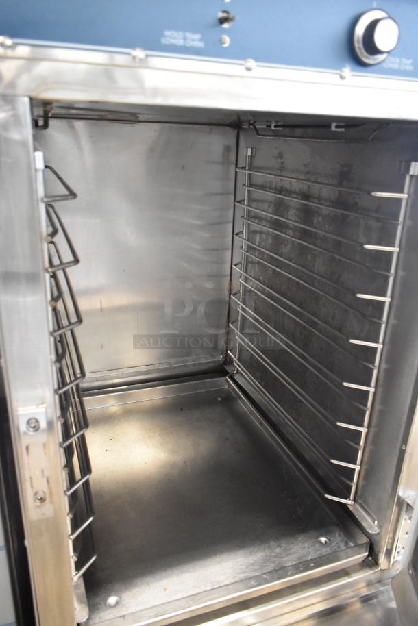 Alto Shaam Halo Heat stainless steel commercial Cook N Hold oven on casters, clean interior, adjustable racks visible.