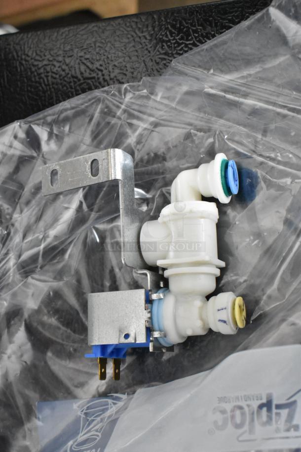 A metal and plastic valve assembly component for a General Electric ZDIS15SSHRHA ice machine, shown in packaging.