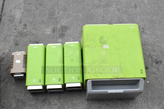 Set of five Cintas dispensers including green soap dispensers and a paper towel dispenser, some surface wear visible.