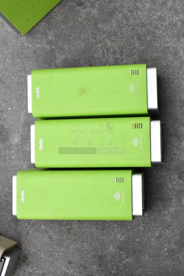 Set of five bright green automatic dispensers, including paper towel and soap dispensers. Visible brand markings: "Cintas." Used condition.