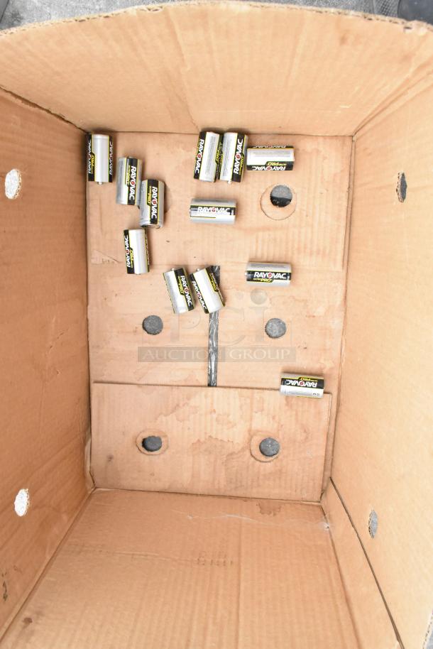 Box containing multiple Rayovac batteries, cardboard showing some wear.
