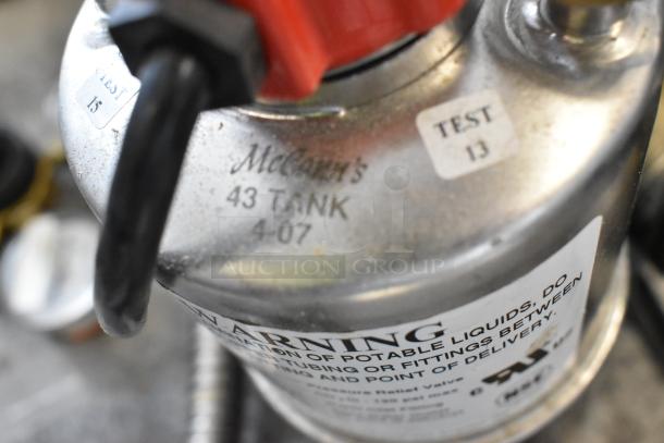 McCann's 43 Tank with visible markings, including "TEST 13" label. Part of auction lot with various items.