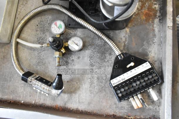 Lot of various items including cold plate, McCann's tank, and Wunder-Bar dispenser. Mixed condition, ideal for equipment collectors.