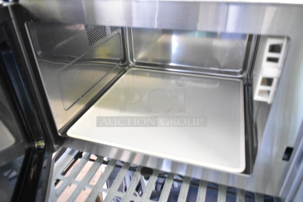 2023 Solwave 180MW1000D stainless steel commercial microwave, brand new scratch and dent, inside view, dial control.