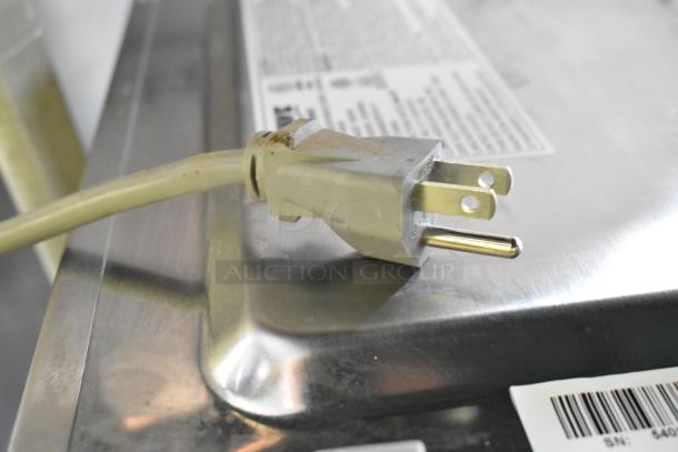Stainless steel Solwave 180MW1000D commercial microwave, 120V. Visible plug and barcode with minor scratch.