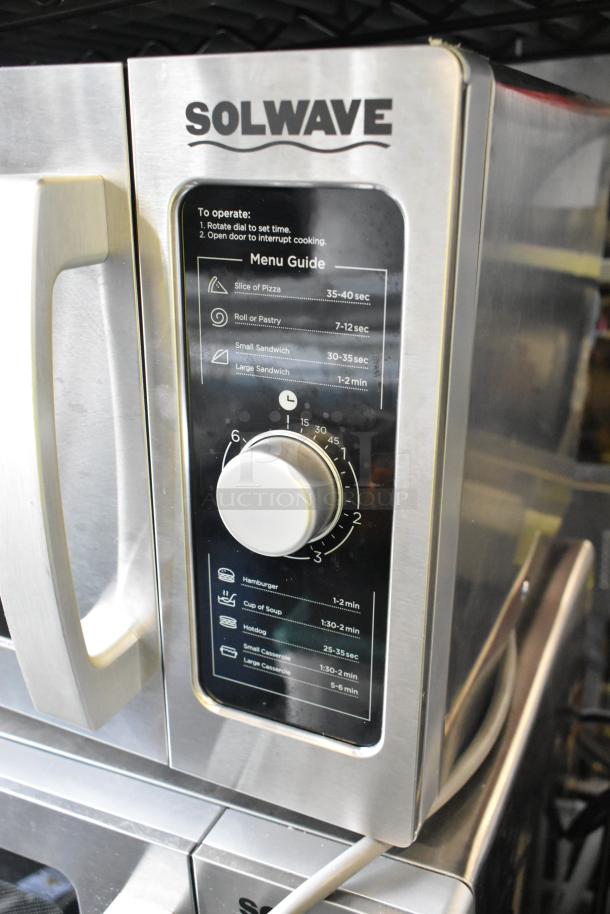 Brand new Solwave 180MW1000D stainless steel commercial microwave with dial control, menu guide visible. 120V, 1 phase.