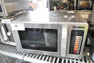 Solwave 180MW1000SS stainless steel commercial microwave, brand new, with push button controls and minor surface scratches.
