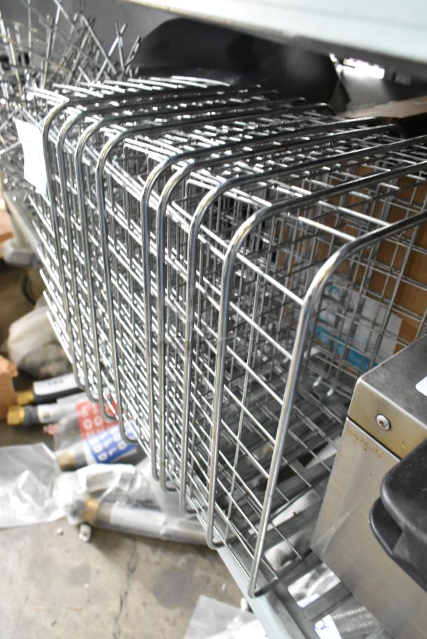 25 stacked metal wire baskets in good condition, featuring square grid design, visible on a shelf.