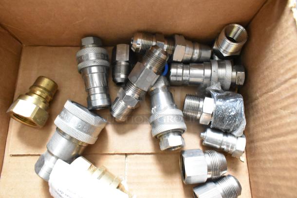 Box containing 17 various metal connectors, including brass and steel types, some wrapped in plastic. Suitable for industrial use.