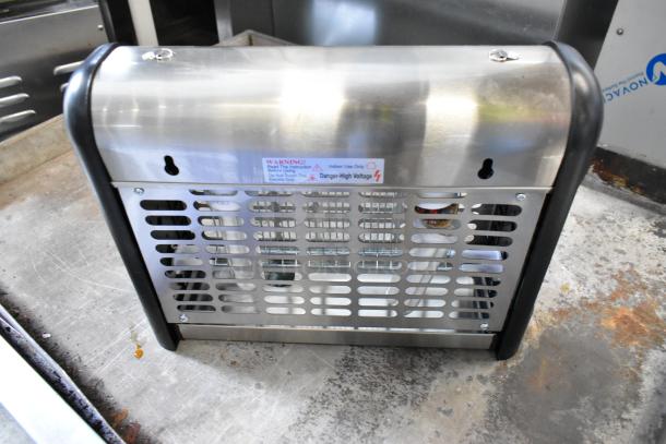 Brand new Zap n Trap Bug Zapper, 120 Volts, 1 Phase, stainless steel, protective grille, indoor use warning label.
