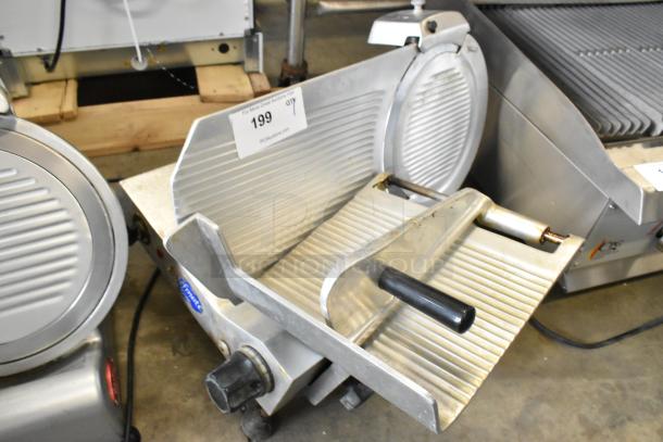 Globe GC12D metal countertop meat slicer with blade sharpener, 115 volts, 1 phase, used condition. Auction tag visible.