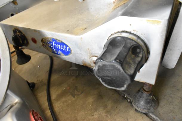 Globe GC12D metal meat slicer, 115V, with blade sharpener. Used condition, visible wear. Chefmate label displayed.