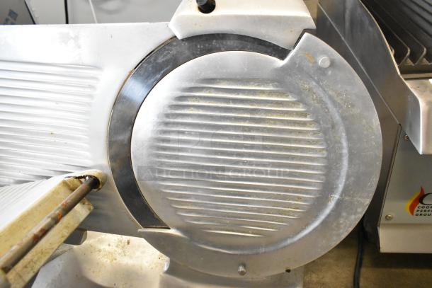 Globe GC12D metal countertop meat slicer with blade sharpener, 115 volts, 1 phase, showing moderate wear.