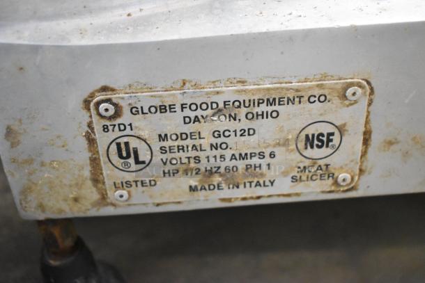 Globe GC12D Metal Commercial Meat Slicer with Blade Sharpener. Model shown with label indicating 115 volts, 1 phase, made in Italy.