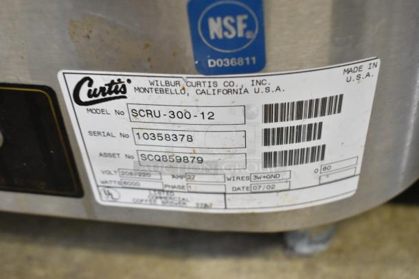 Curtis SCRU-300-12 stainless steel commercial coffee urn, 208/220V, 1 phase, model label visible, NSF certified.
