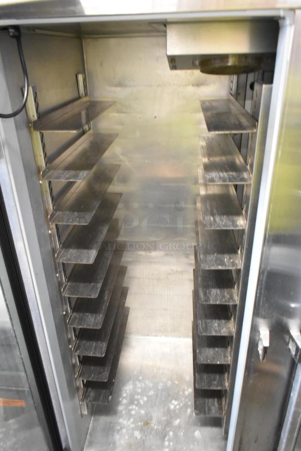 Continental 2RE-GD 2 Door Reach-In Cooler, metal interior, adjustable shelves, commercial casters, 115V, 1 phase.