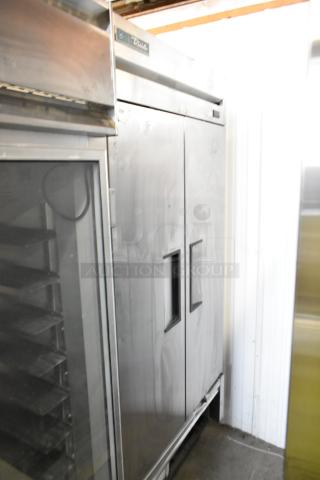 2021 True T-35-HC stainless steel 2-door cooler on casters, commercial-grade, 115V, excellent condition with logo visible.