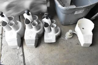 5 food processor pieces, including 3 continuous feed heads and S blade, white, used condition, labels visible.