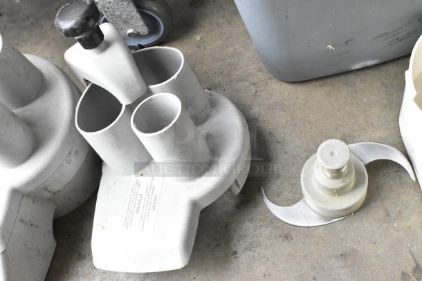 5 food processor pieces, including 3 continuous feed heads and S blade, in good condition. Caution label visible.