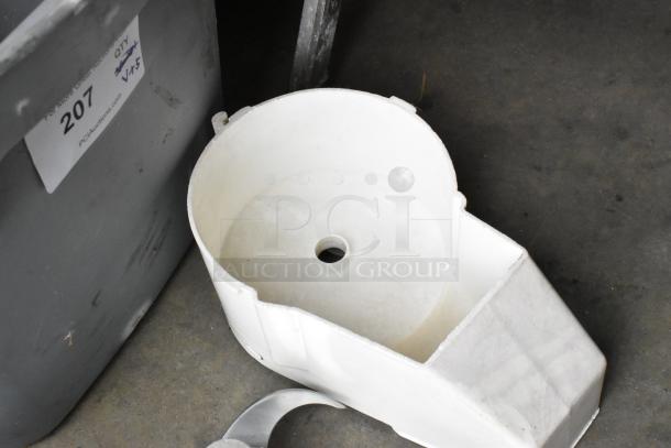 5 food processor pieces including 3 continuous feed heads and S blade, shown with container labeled "207."