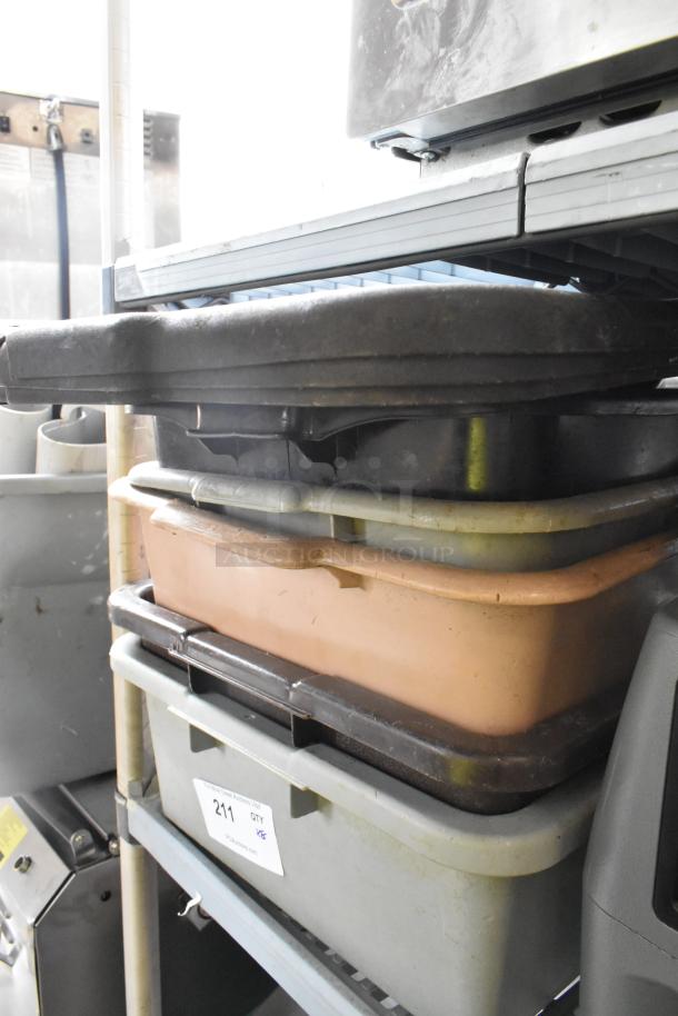 Lot of 8 poly items including assorted bus bins and lids. Visible wear. Auction tag labeled "211 QTY 1."