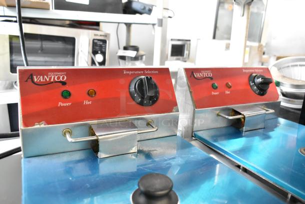 Avantco 177P102 stainless steel commercial countertop fryer with dual controls, 2 fry baskets, and 2 metal lids. 120V, 1 phase.