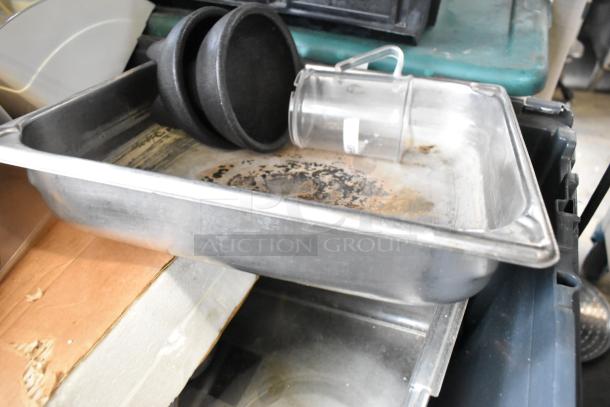 Tier lot of various items including metal poly bins, black utensils, and a clear drop-in bin, showing signs of wear.