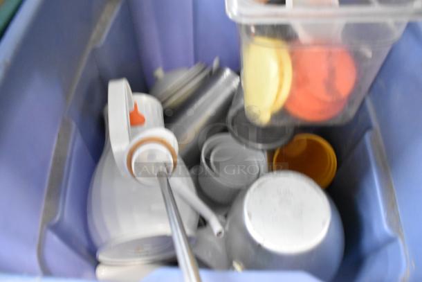 Various kitchen items including poly bins, assorted utensils, and drop-in bins in good condition, grouped in a blue container.