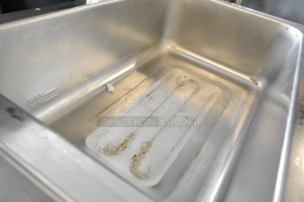 Avantco 177W50CKR stainless steel commercial food warmer, shows minor wear. Model, voltage, and phase not visible.