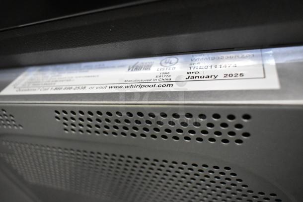 Brand new Whirlpool WMMS3330RZ01 stainless steel microwave, 120V, 1 phase, scratch and dent, label shows manufacture date January 2025.