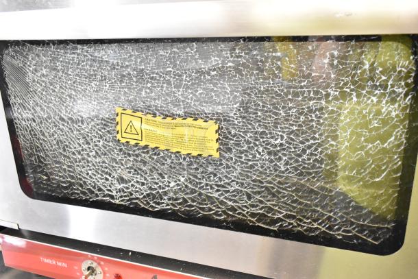 Avantco 177CO16 half-size convection oven with stainless steel exterior. Notable broken glass door. 120 volts, 1 phase.