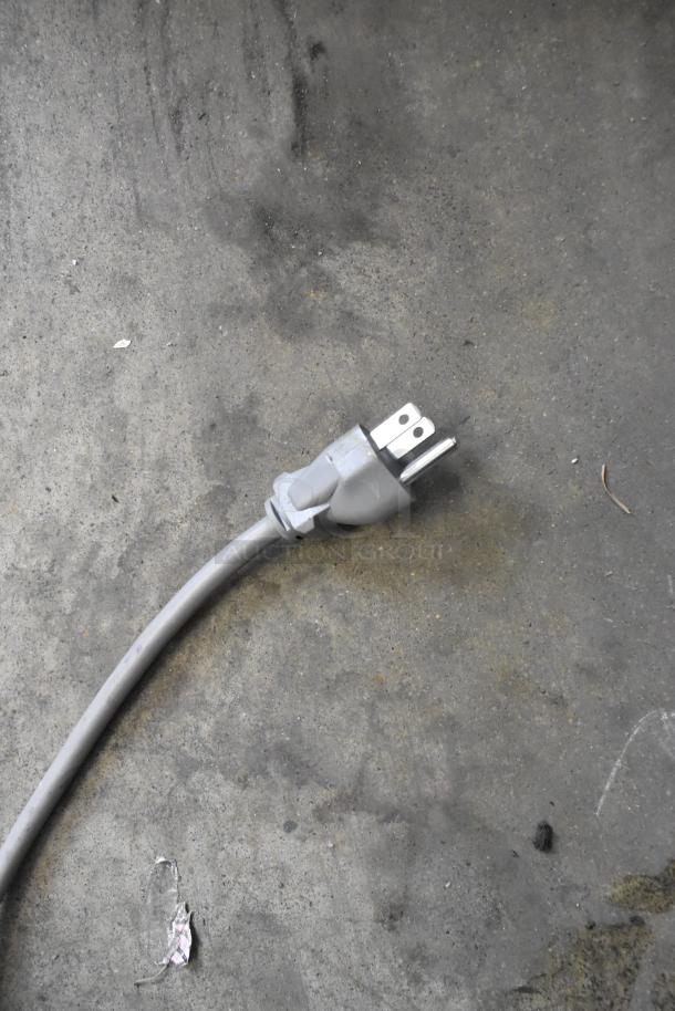 Power cord for the 2023 Solwave 180MW1000SS Stainless Steel Commercial Microwave, 120 Volts, showing a grey plug.