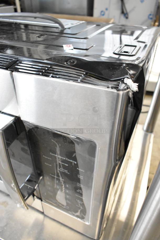 Brand new 2025 GE JVM3160RF9SS stainless steel microwave, scratch and dent, 120V, 1 phase, visible dent on corner.