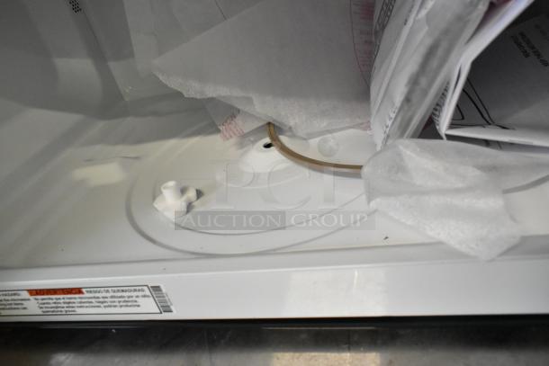 Brand new GE JVM3160RF9SS stainless steel microwave interior; scratch and dent condition, 120V, documents inside.