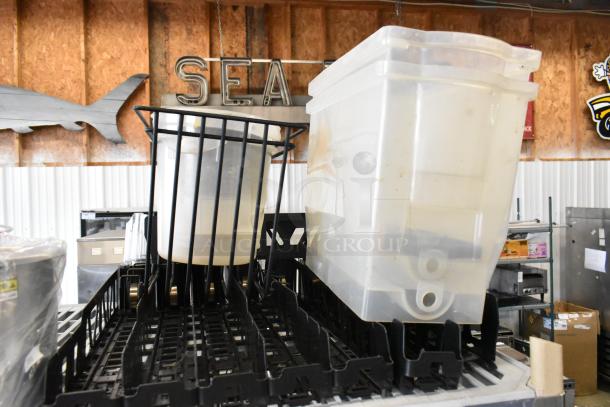Tier lot including a poly bowl and beverage dispensers on a shelf. Items show light wear, ideal for varied uses.