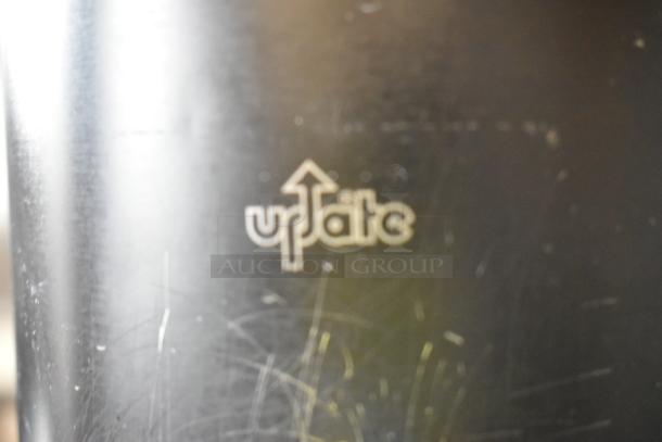 Pair of black Update air pots, minor surface scratches, brand logo visible.