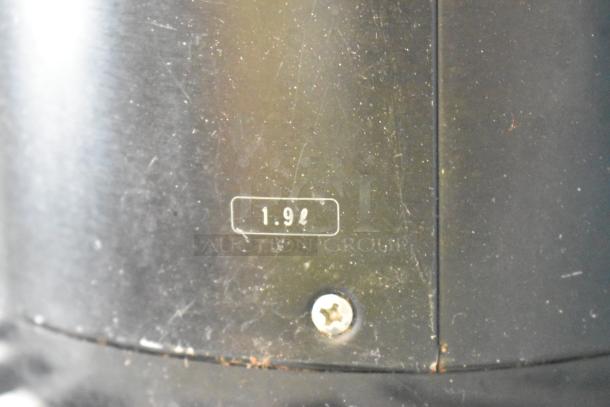 Two black air pots featuring 1.9-liter capacity marking and visible screw on the metal surface, suitable for beverage storage.