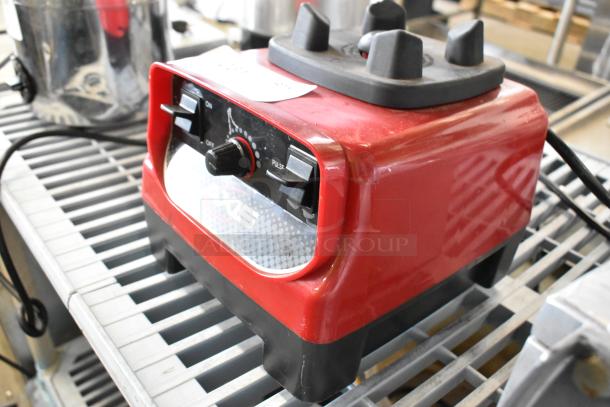 Axis Metal Countertop Blender Base, red, 120 volts, 1 phase, in used condition. Features include on/off switch and pulse setting.
