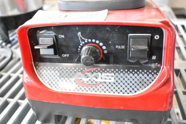Axis metal countertop blender base, 120 volts, 1 phase. Features on/off, pulse switch, and dial. Red housing with Axis logo.
