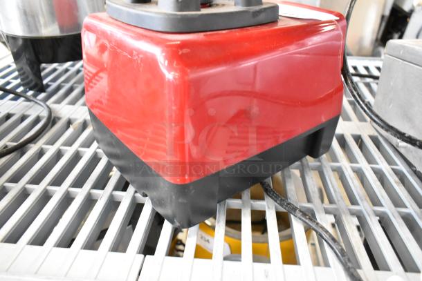 Red Axis Metal Countertop Blender Base, 120 Volts, 1 Phase, with slight surface scratches, on metal grid shelf.