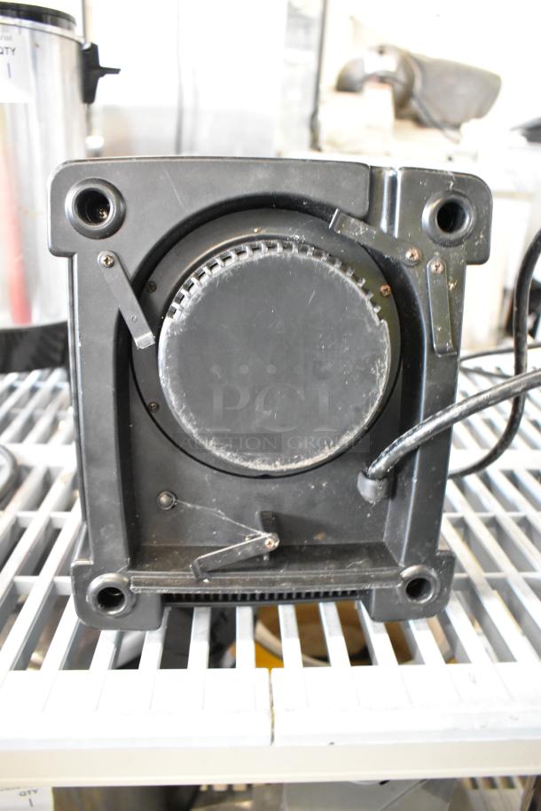 Axis metal countertop blender base, 120 volts, 1 phase. Black with visible wiring and mounting points. Good condition.