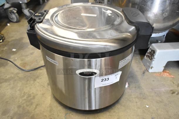 Galaxy 177RWG90 Stainless Steel Electric Rice Cooker, 120V, 1 Phase. Features "Caution: Hot Surface" labels and auction tag.