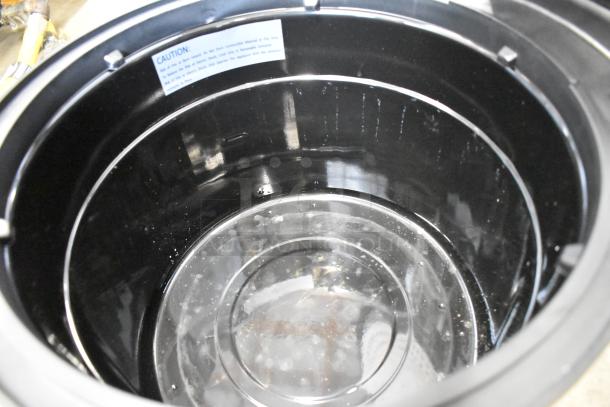 Galaxy 177RWG90 electric rice cooker interior, stainless steel, 120 volts, 1 phase. Caution label visible.