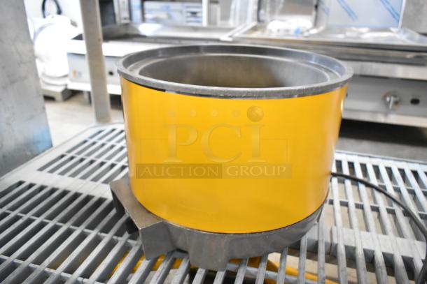 Vollrath HS-11 metal countertop soup kettle, yellow, 120 volts, good condition, used for commercial food warming.