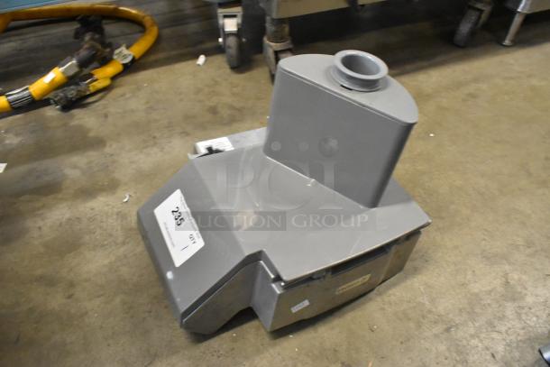 Metal countertop continuous feed head for food processor, gray, sturdy design, used condition, auction tag visible.