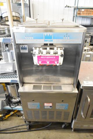 Taylor 339-27 Stainless Steel Commercial Floor Style Air Cooled 2 Flavor w/ Twist Soft Serve Ice Cream Machine on Commercial Casters. 208-230 Volts, 1 Phase. - Item #1210001