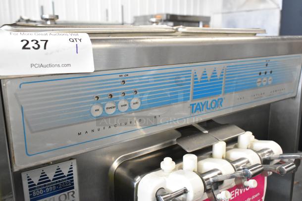 Taylor 339-27 stainless steel 2-flavor soft serve ice cream machine, air cooled, on casters, 208-230V, 1 phase.